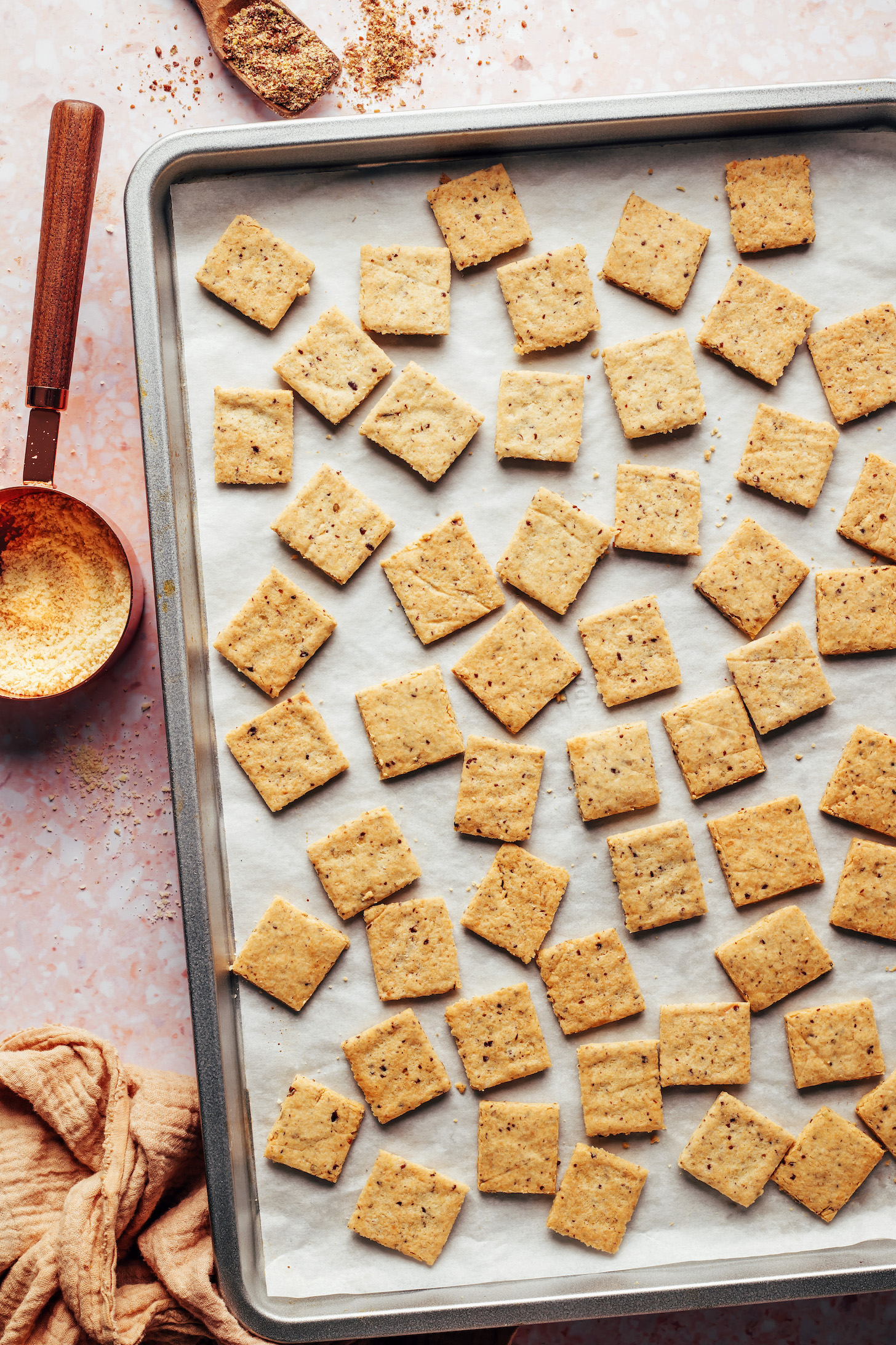 Freshly baked almond flour crackers on a baking sheet