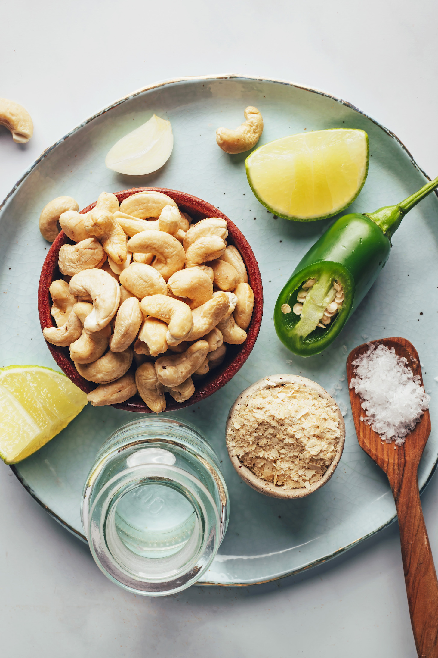 Cashews, limes, salt, nutritional yeast, water, garlic, and jalapeño