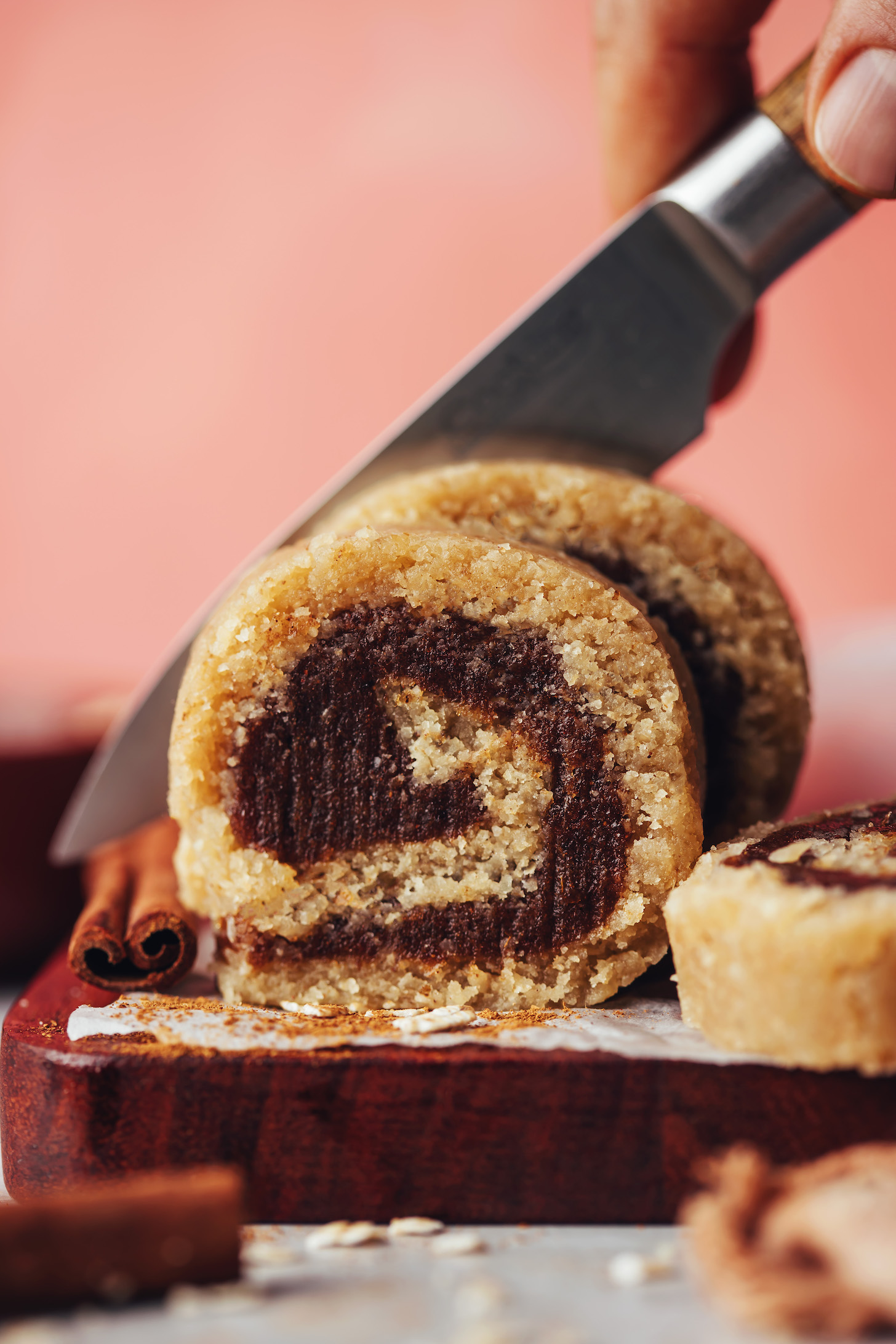Slicing no-bake vegan cinnamon rolls