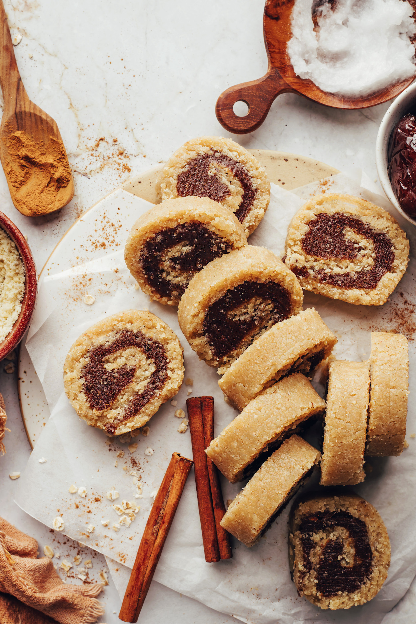 No-bake cinnamon rolls surrounded by ingredients used to make them