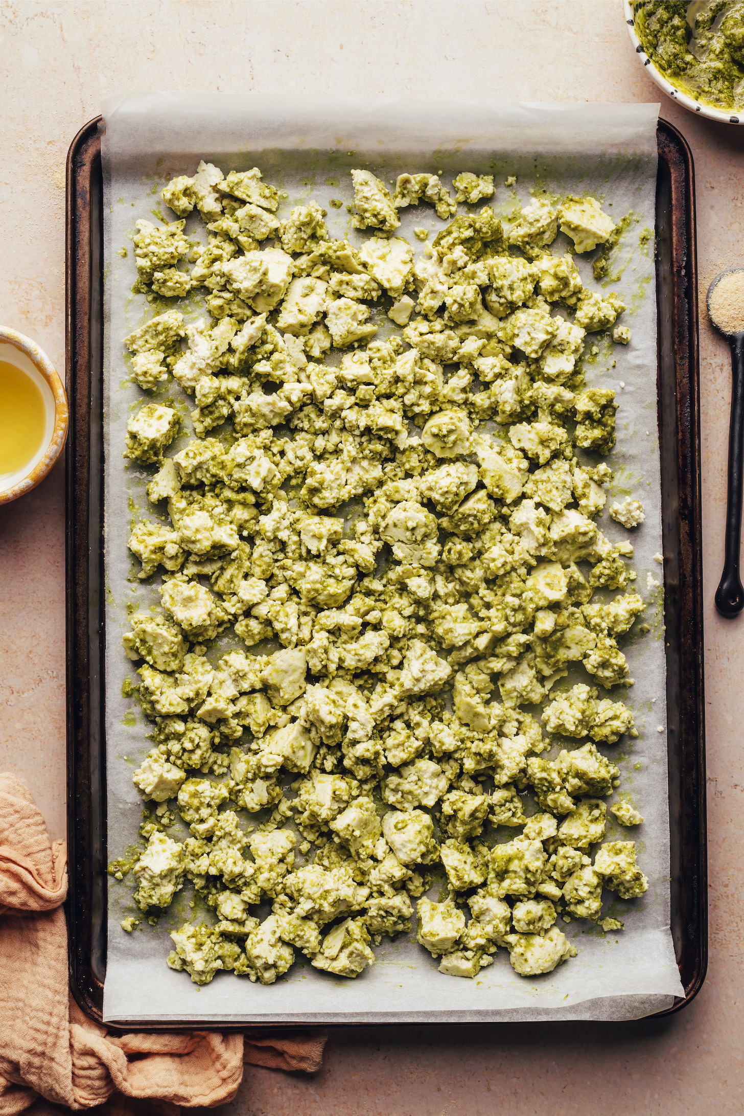 Crumbled tofu coated with vegan pesto