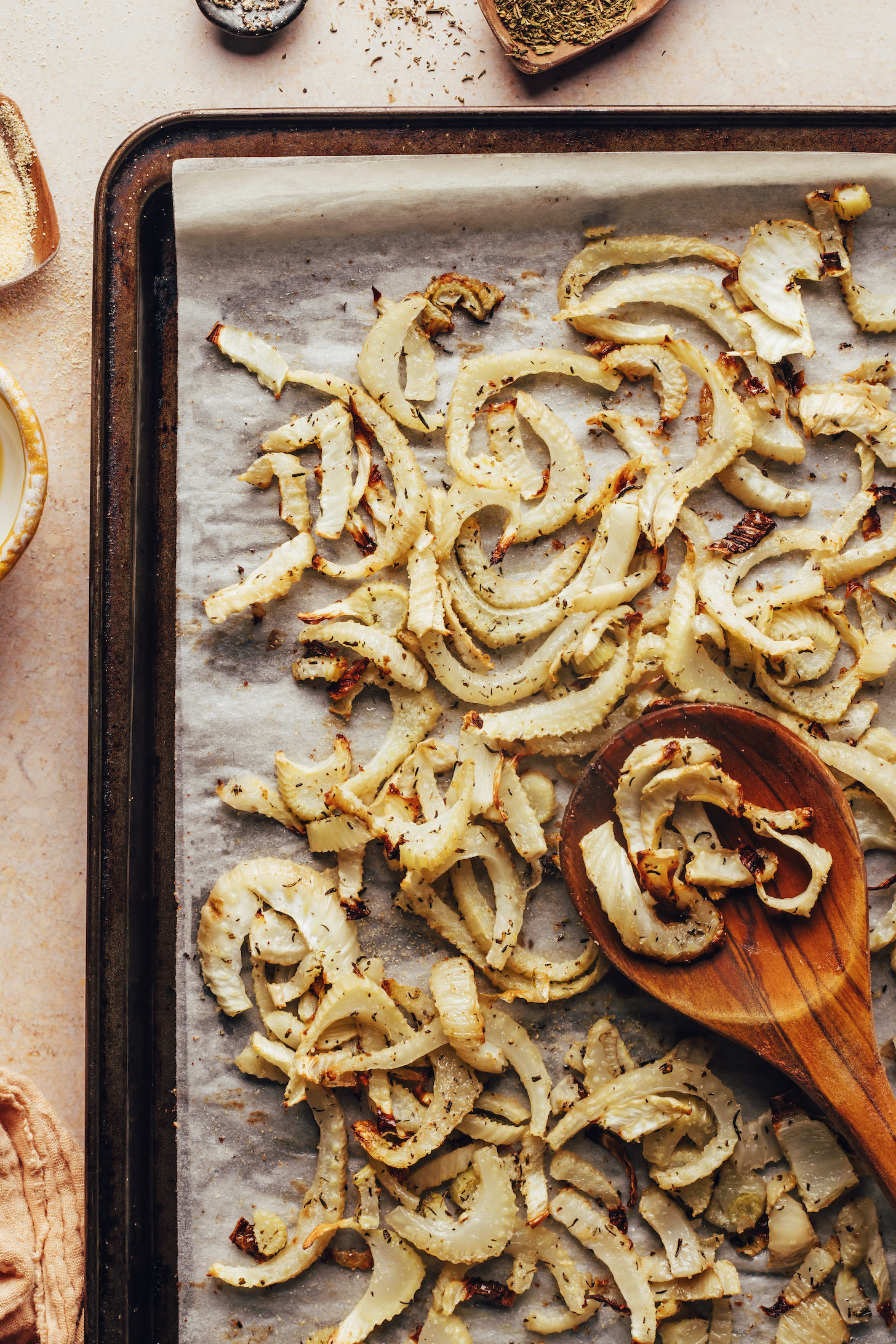 Parchment-lined baking sheet with roasted fennel