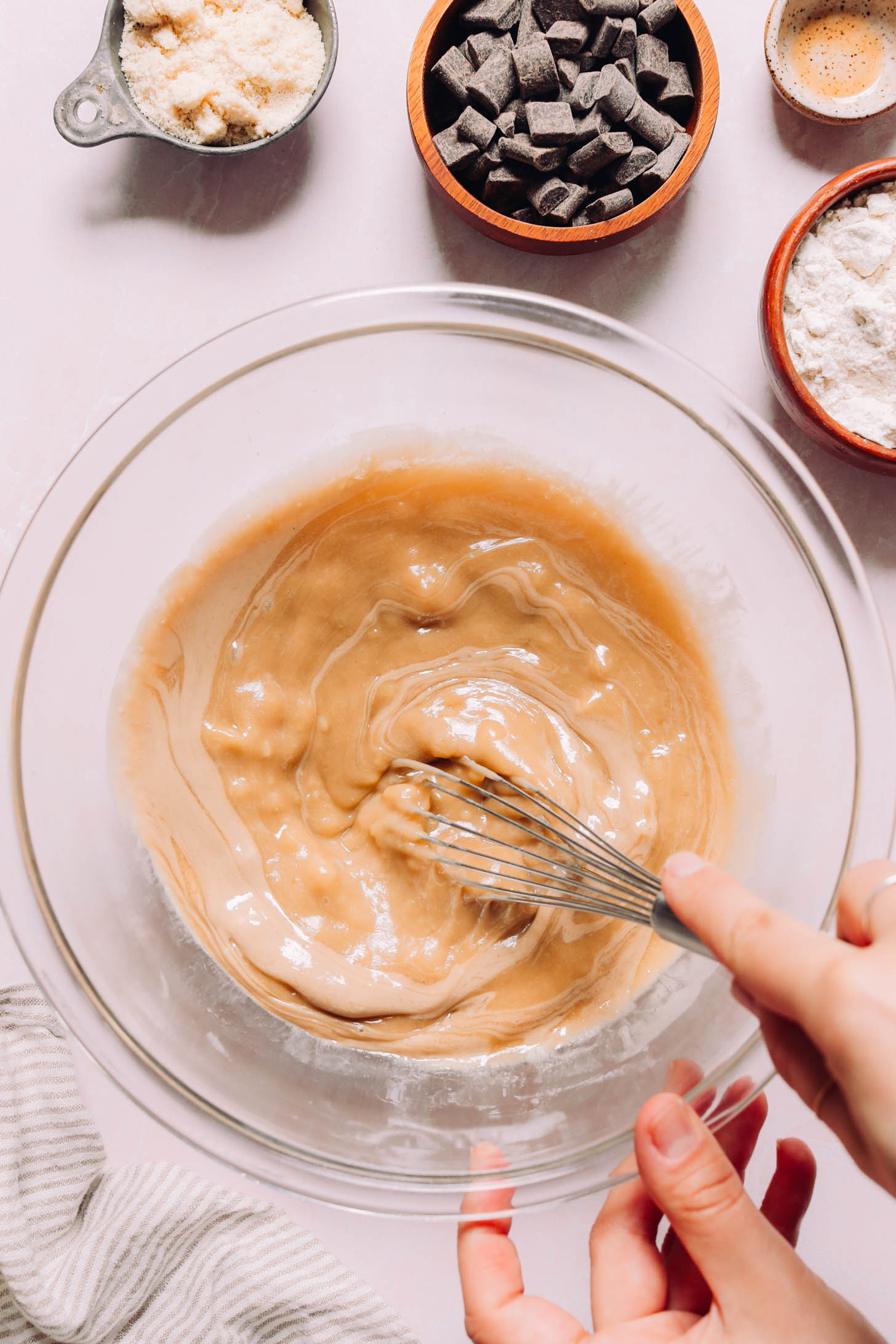 Using a whisk to combine the wet ingredients