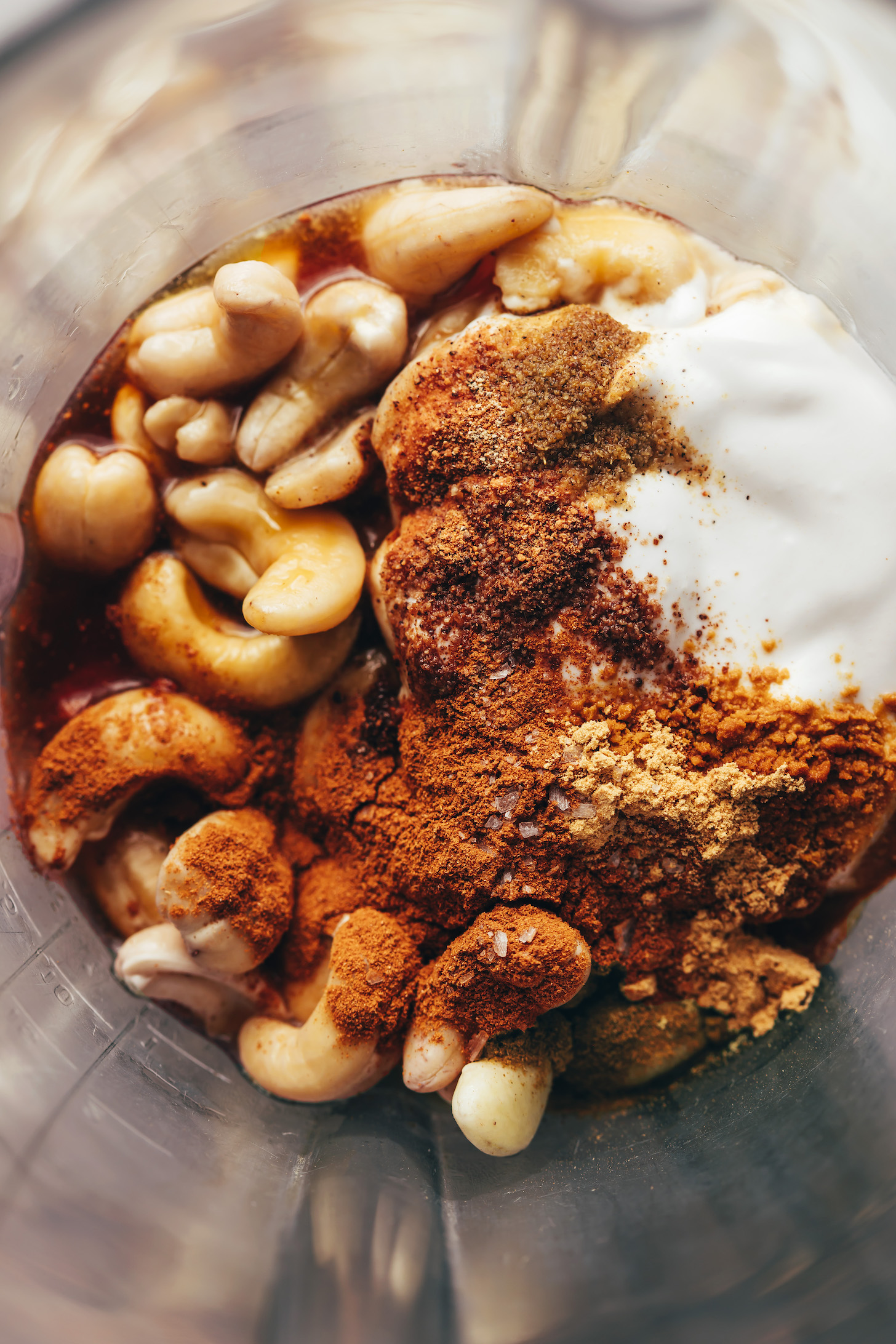 Blender with cashews, chai spices, coconut milk, and maple syrup
