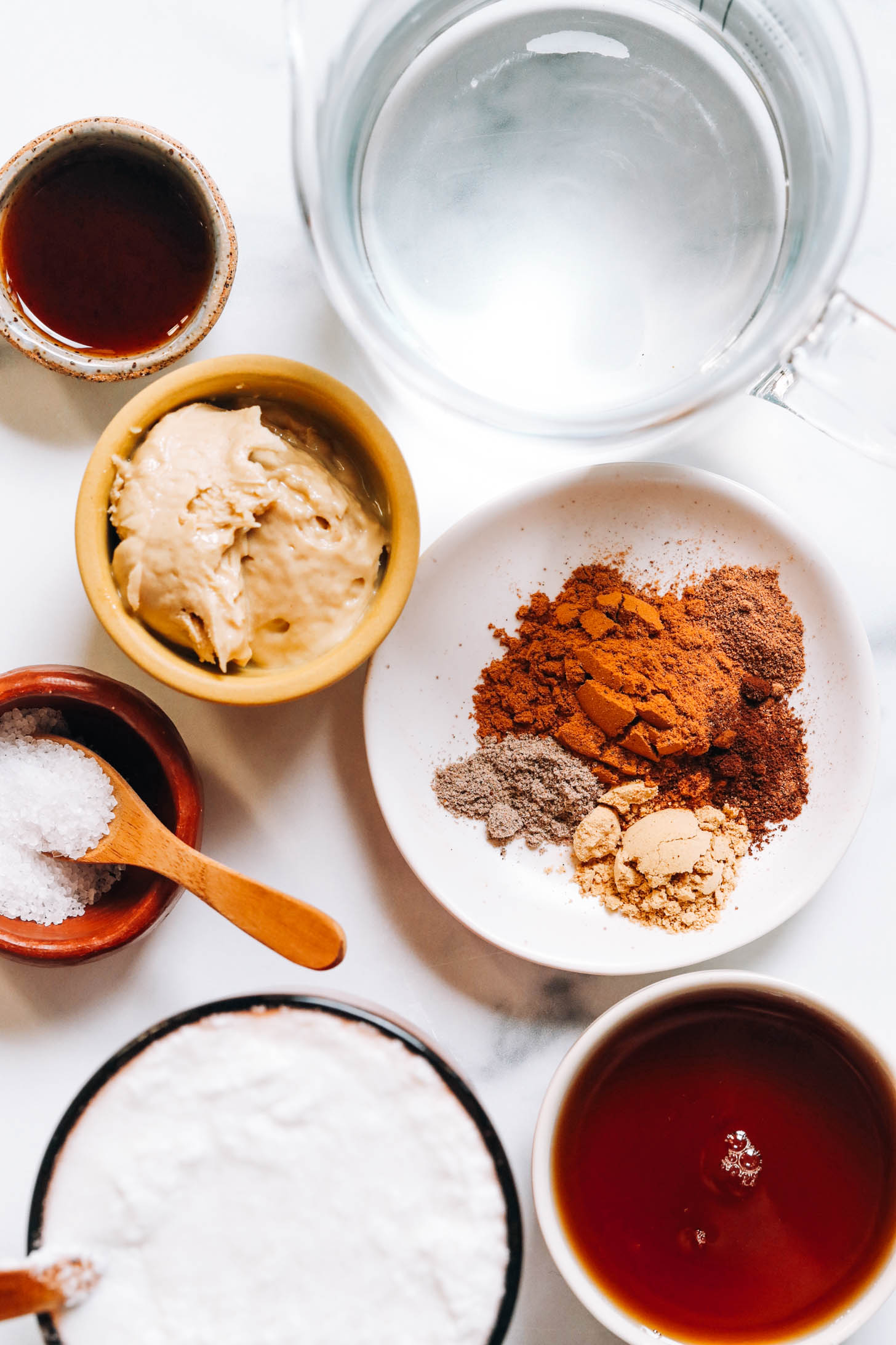 Water, maple syrup, spices, cashew butter, salt, coconut milk, and vanilla extract