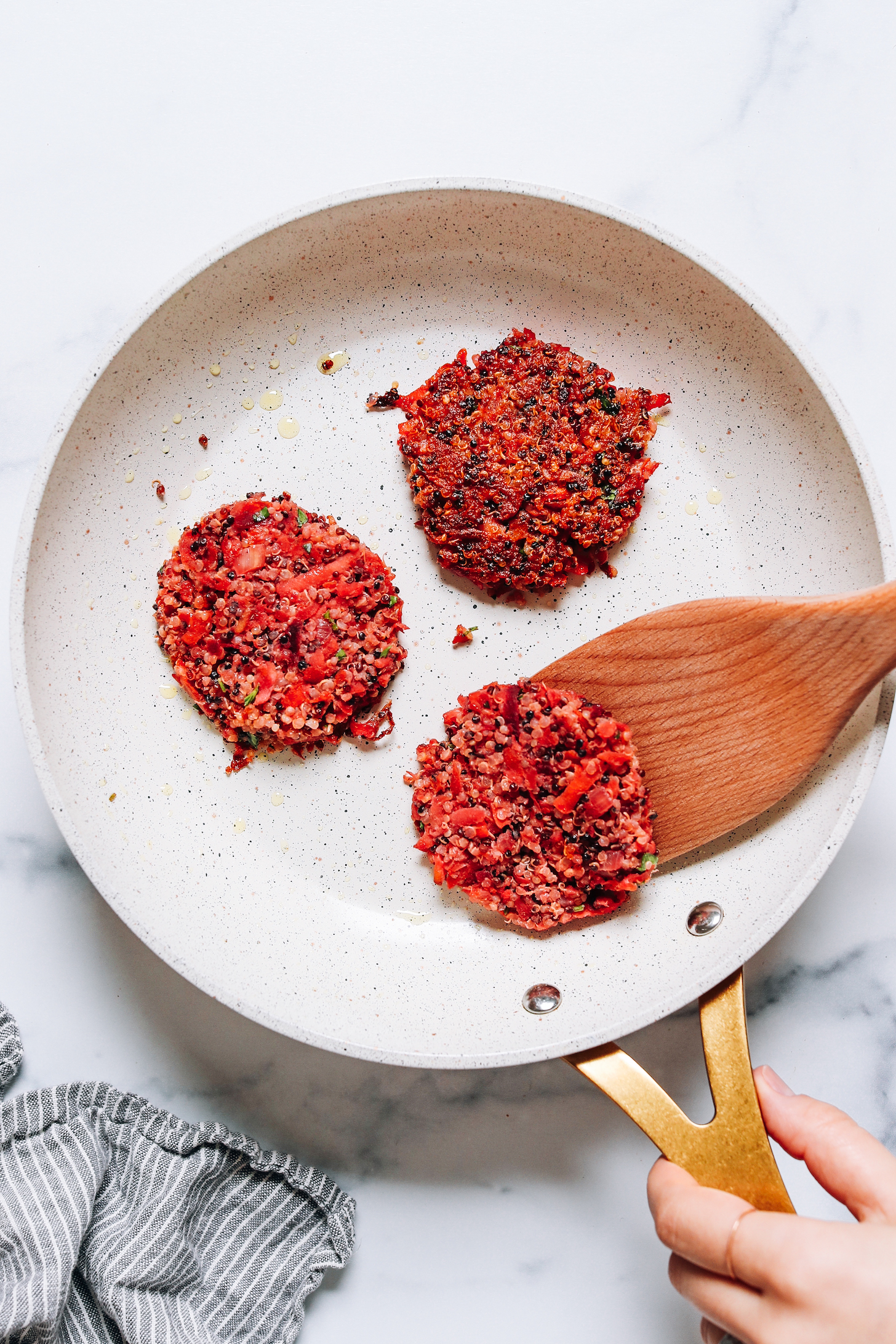 Cooking root vegetable fritters in a skillet