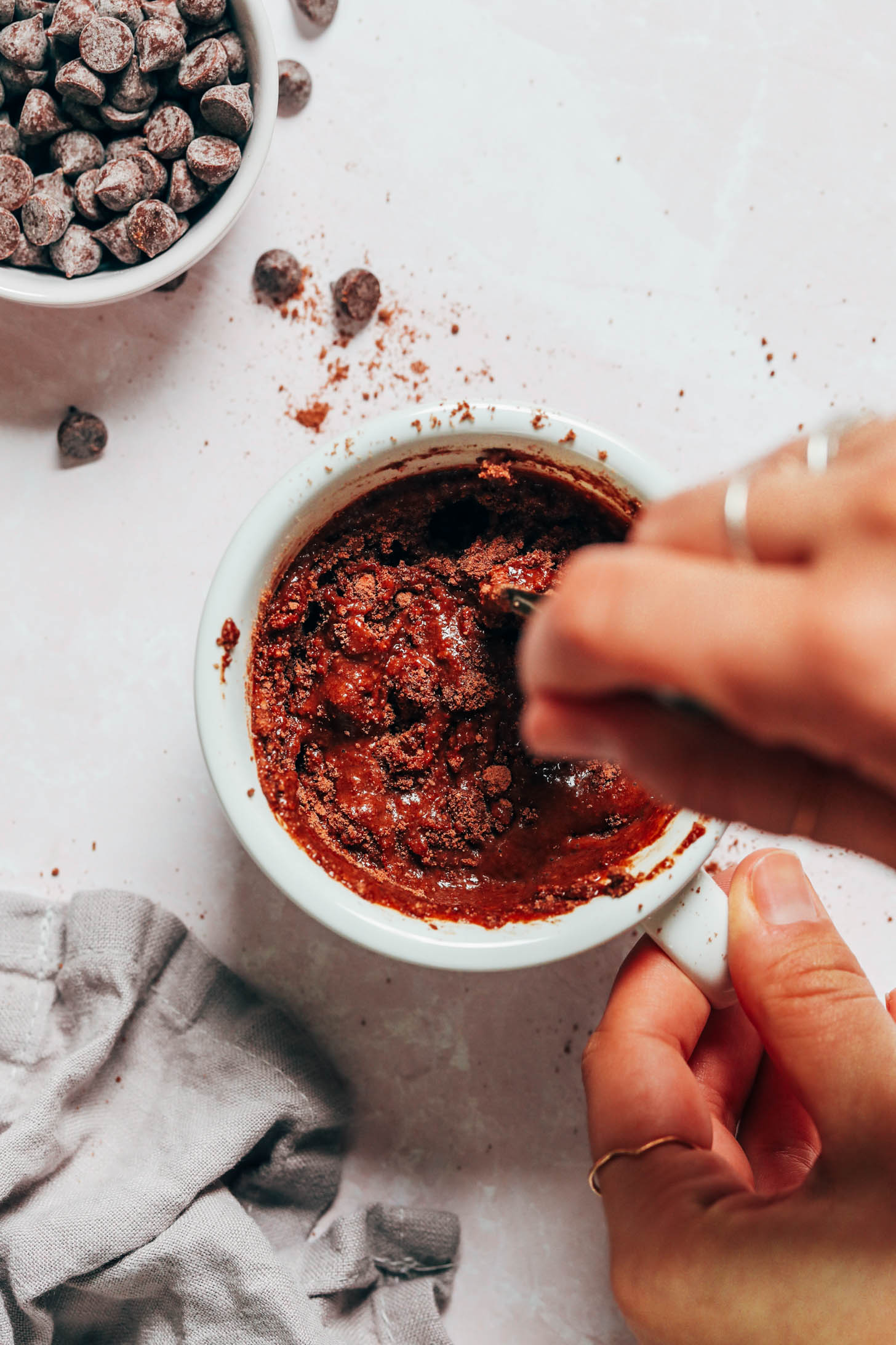 Stirring together chocolate cake mix and wet ingredients in a mug