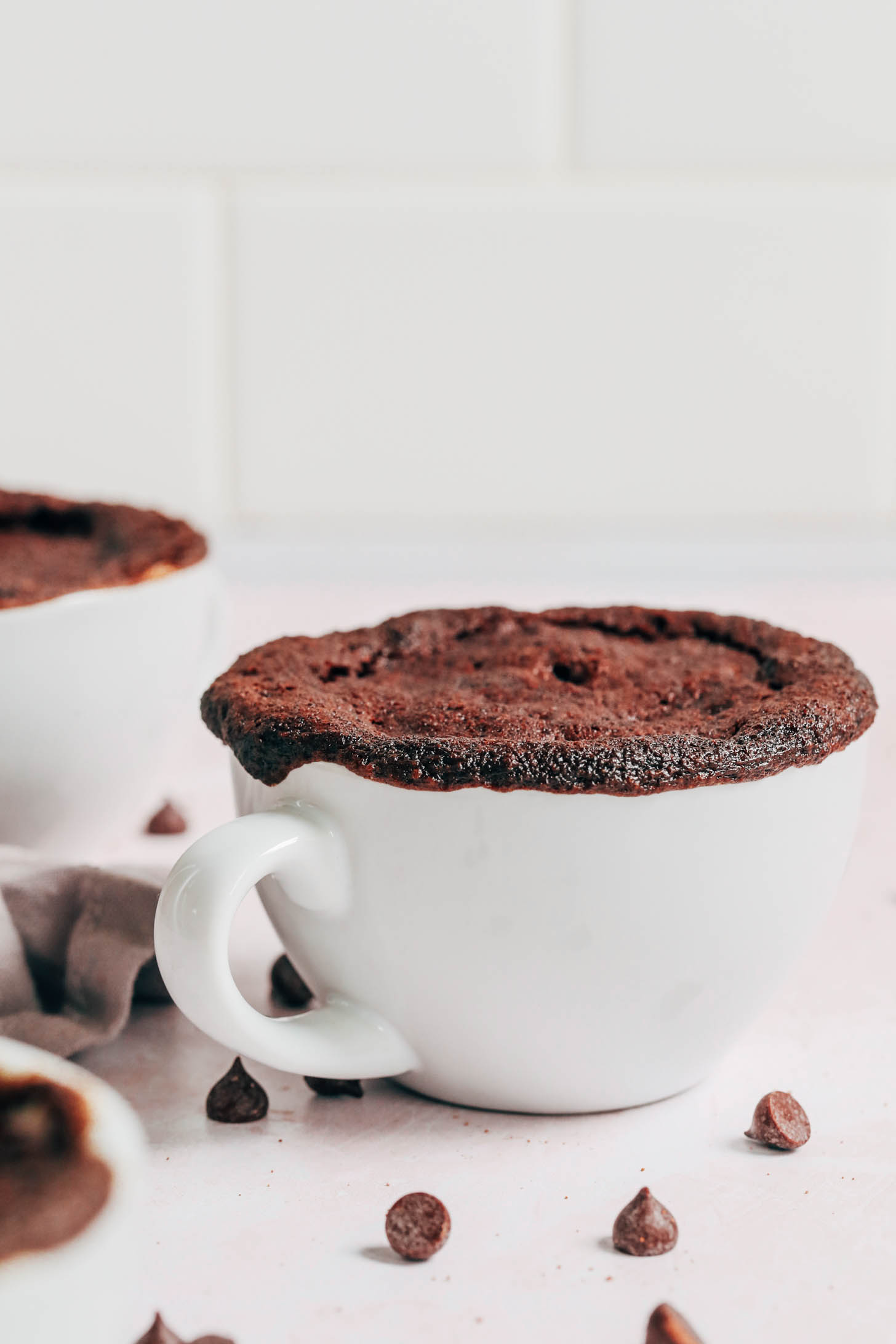 Overflowing mug of chocolate cake