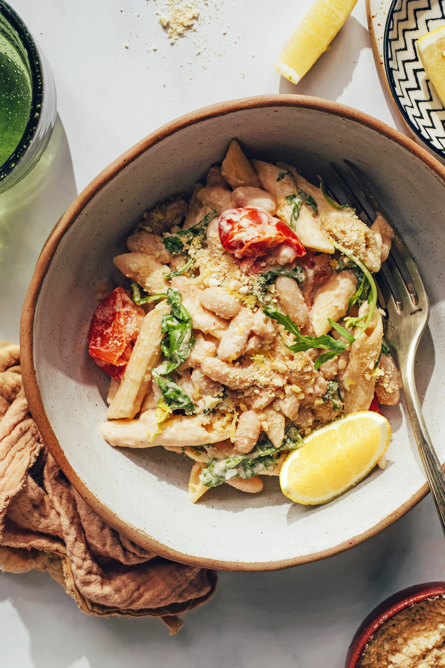 Bowl of lemon garlic white bean pasta with veggies