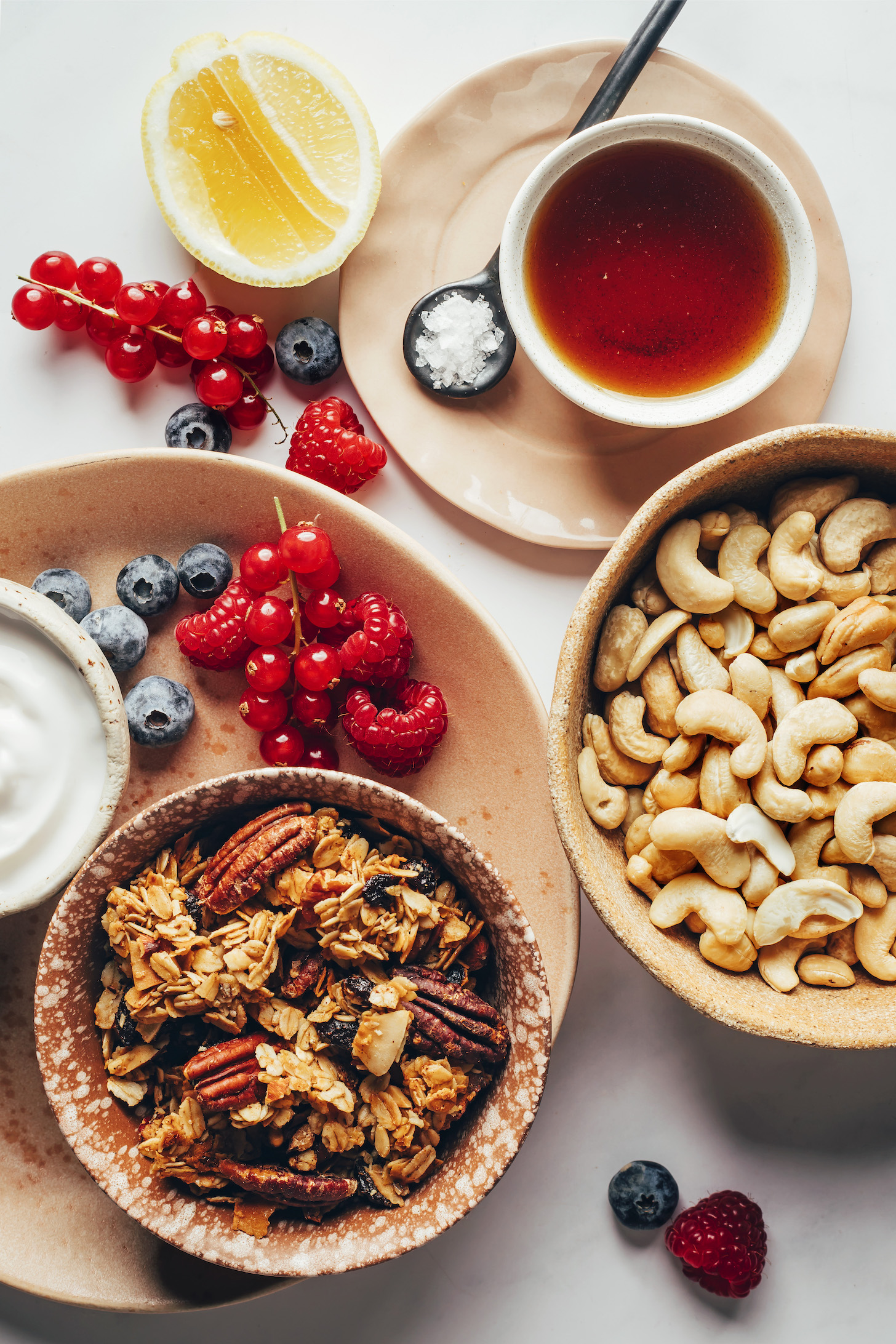 Fresh berries, coconut yogurt, granola, cashews, maple syrup, salt, and lemon