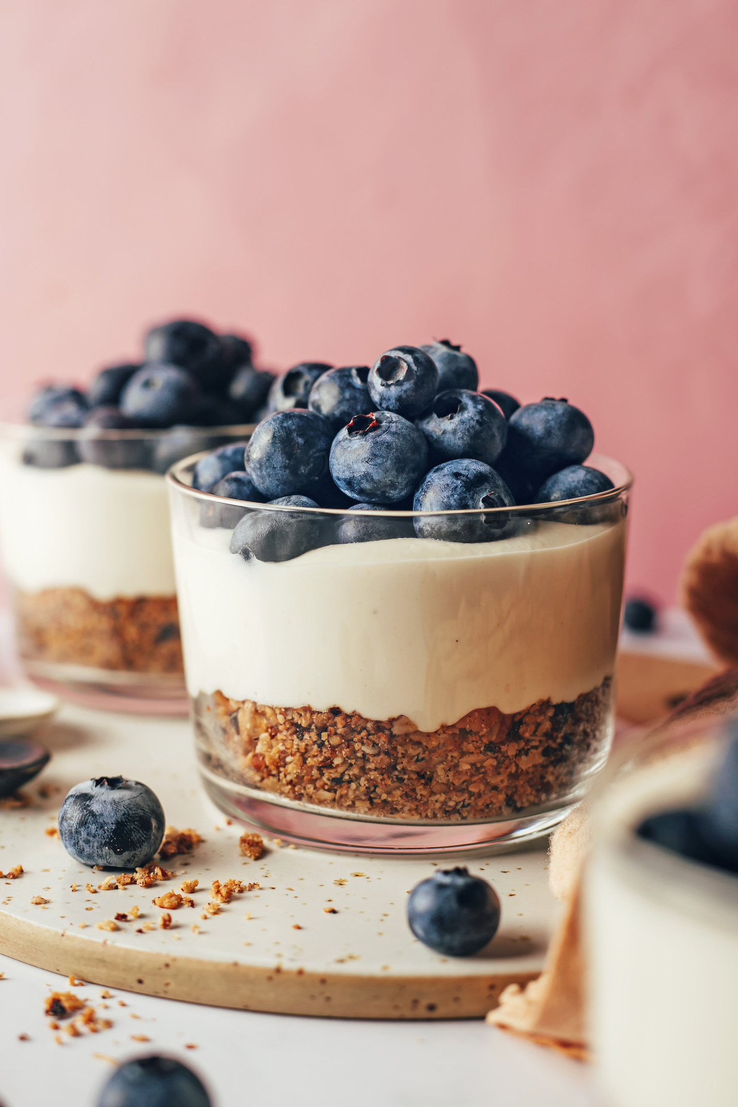 No-bake vegan cheesecake cups topped with fresh blueberries