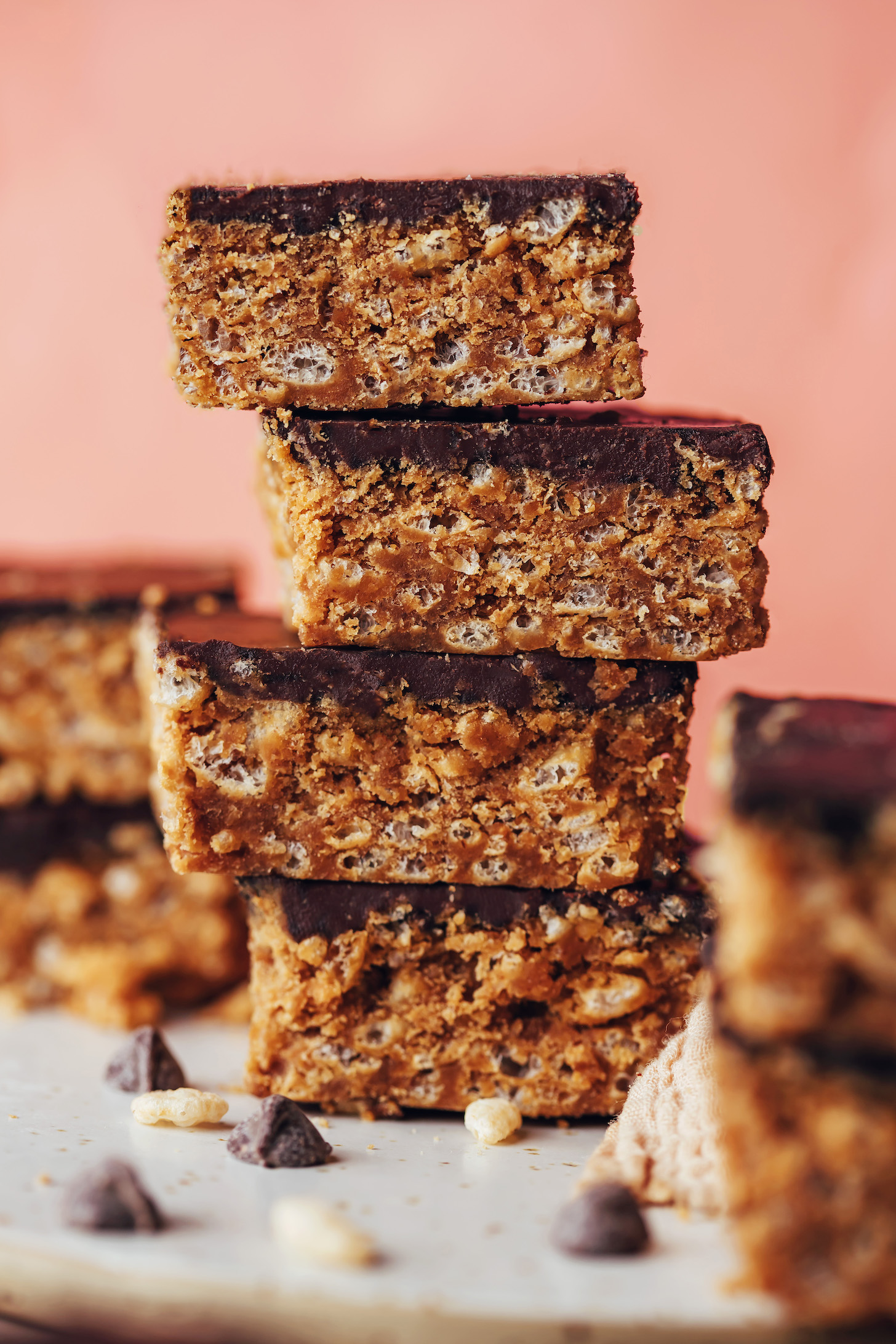 Stack of four homemade vegan scotcheroos made without corn syrup or butterscotch chips