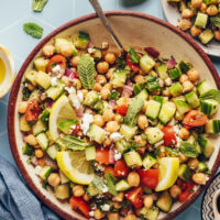 Overhead shot of two bowls of cucumber chickpea salad for our round-up of cucumber recipes