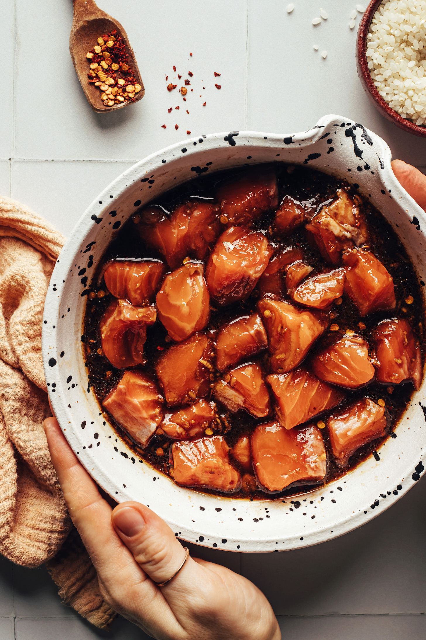 Cubed salmon marinating in a ginger garlic tamari marinade