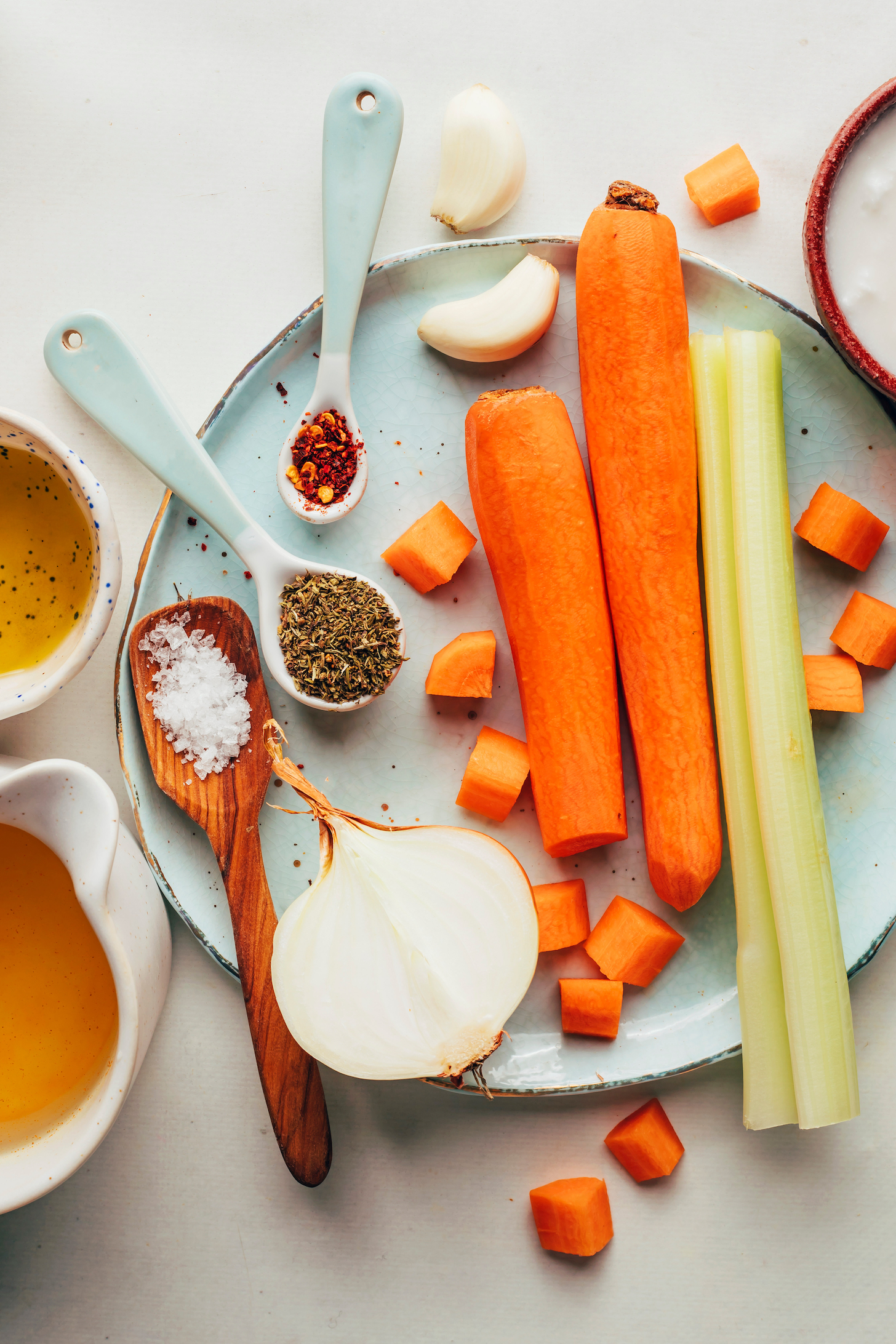 Carrots, celery, garlic, onion, thyme, red pepper flakes, coconut milk, flaky salt, vegetable broth, and olive oil