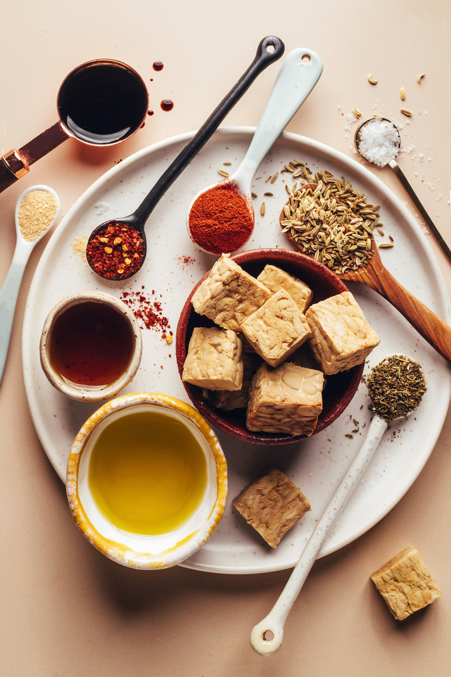Cubed tempeh, fennel seeds, smoked paprika, red pepper flakes, garlic powder, tamari, maple syrup, olive oil, and dried thyme