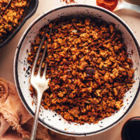 Fork in a bowl of vegan Italian sausage crumbles