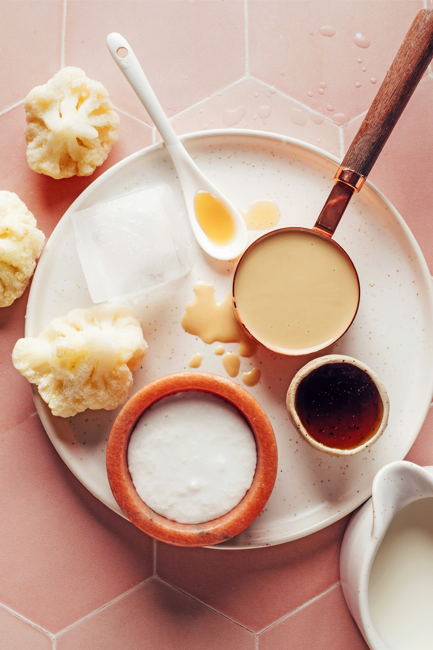 Frozen cauliflower, ice cube, vanilla, tahini, maple syrup, almond milk, and coconut milk
