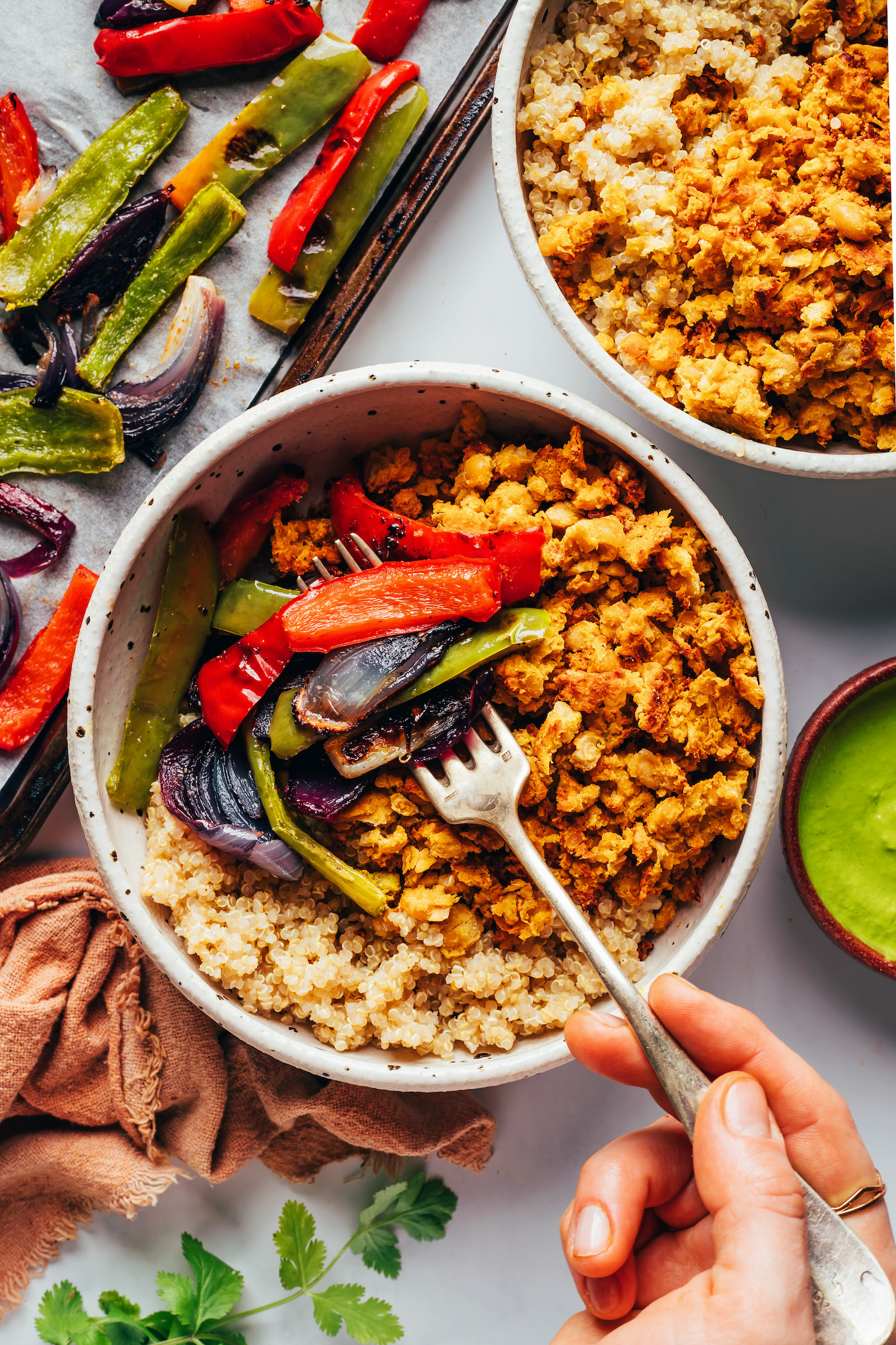 Peruvian-inspired taco bowls with smashed chickpeas, roasted peppers and onions, and spicy aji verde sauce. A flavorful, hearty, vegan and gluten-free meal ready in just 30 minutes! #minimalistbaker #vegan #glutenfree #chickpeas #bowls