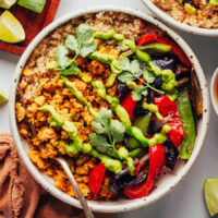 Smashed chickpea vegan taco bowl drizzled with aji verde sauce