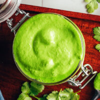 Overhead shot of a jar of vegan aji verde sauce