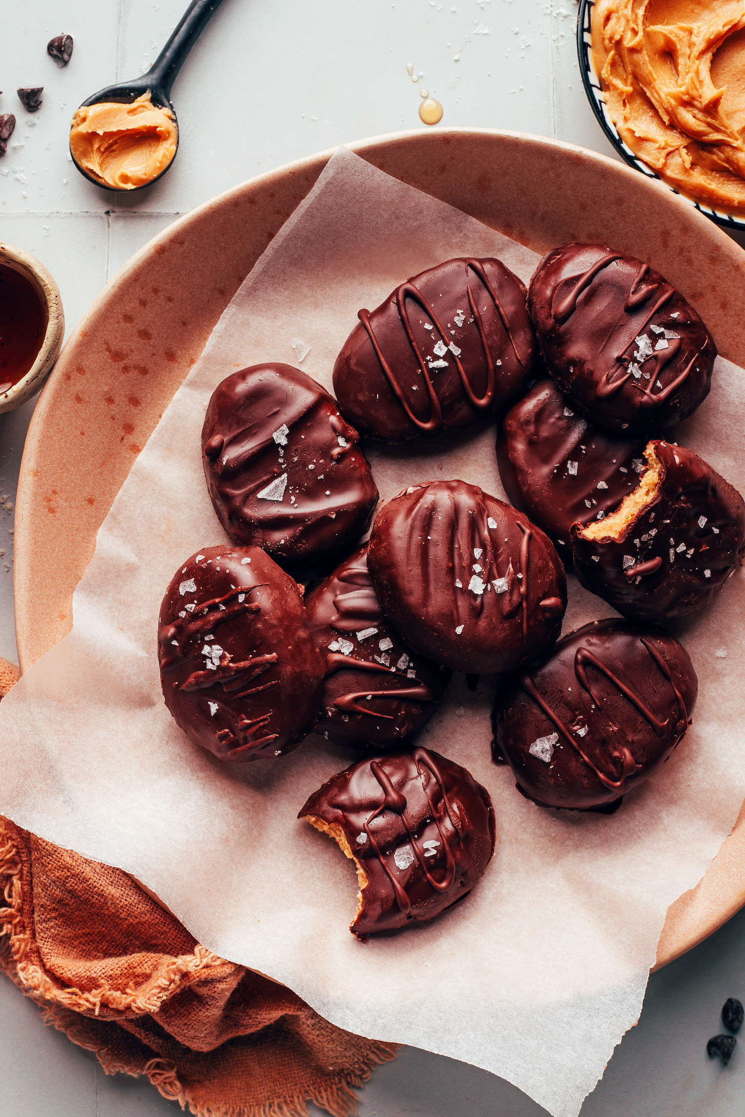 Plate of homemade vegan peanut butter eggs sprinkled with flaky salt