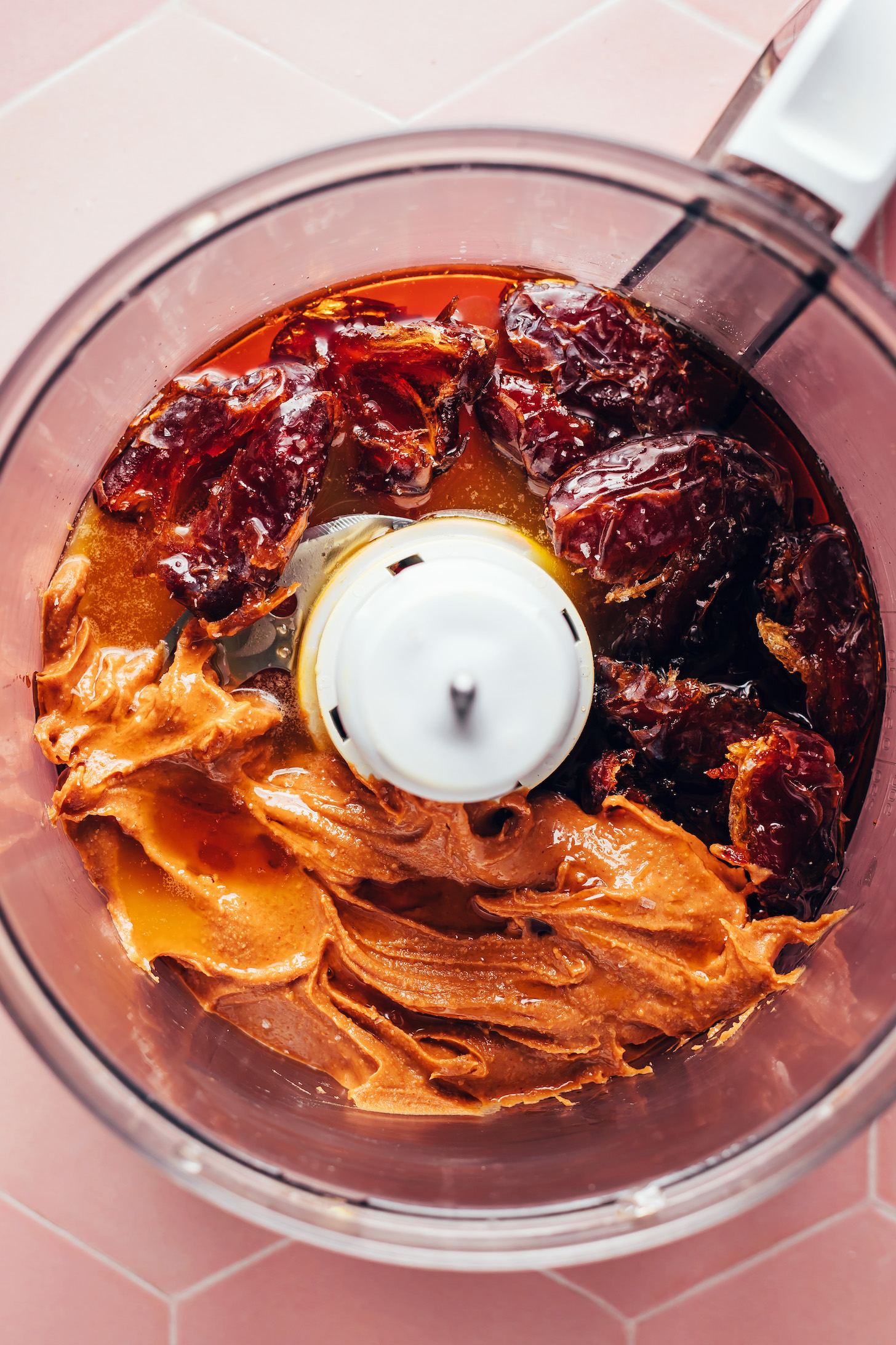 Peanut butter, maple syrup, and dates in a food processor