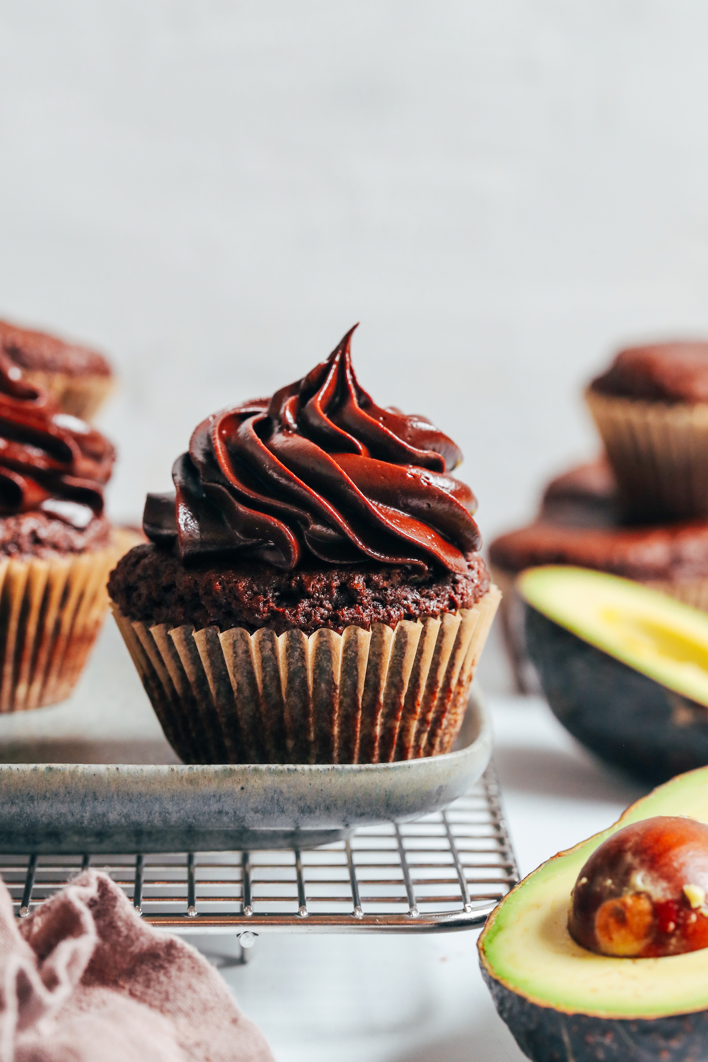 Creamy chocolate avocado frosting on a chocolate cupcake