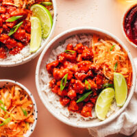 Korean-inspired bowls with gochujang tofu, rice, and kimchi-inspired cabbage apple slaw