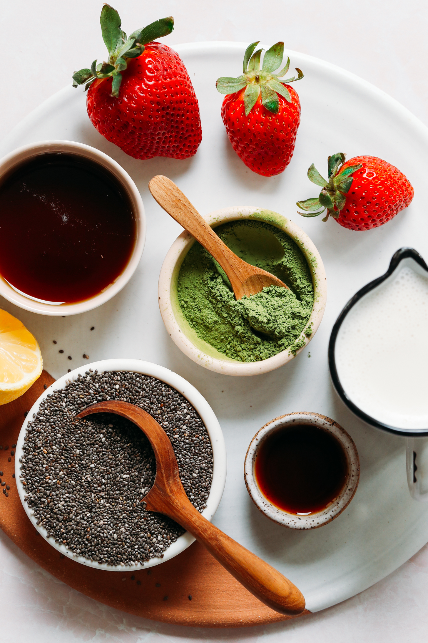 Strawberries, matcha, maple syrup, chia seeds, lemon, vanilla, and dairy-free milk