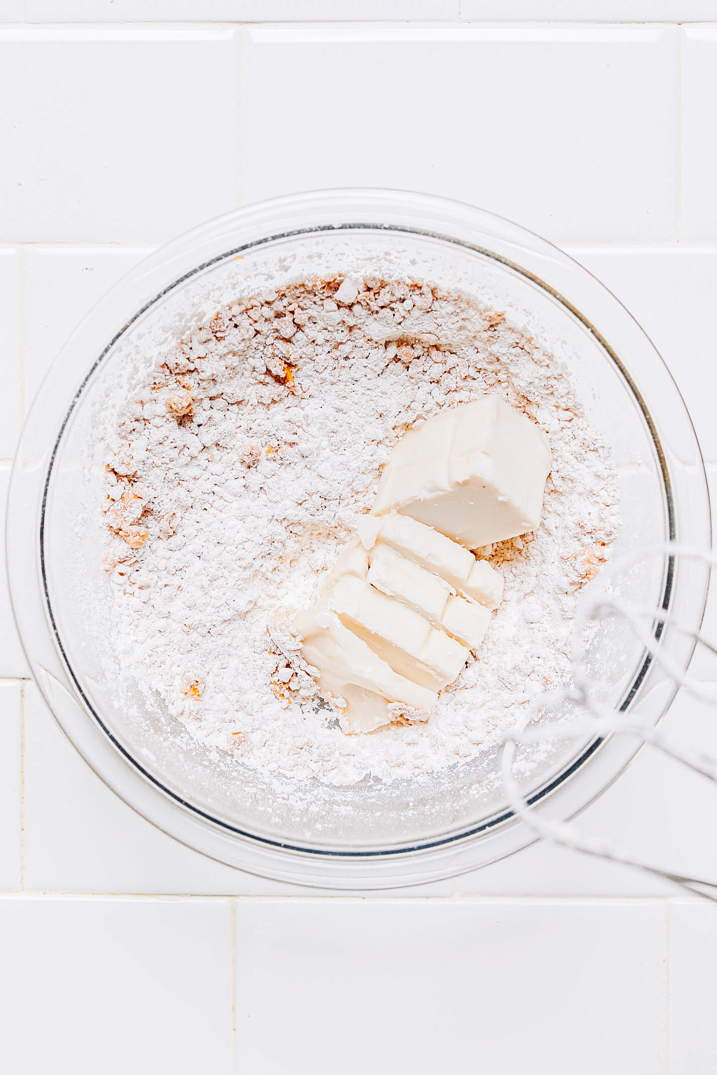Peanut butter, powdered sugar, and vegan butter in a bowl
