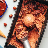 Ice cream scoop in a loaf pan of our vegan Nutella ice cream