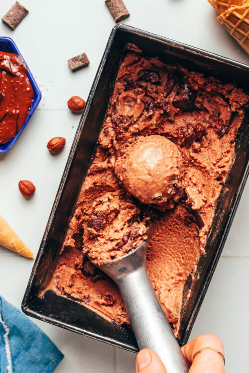 Ice cream scoop in a loaf pan of our vegan Nutella ice cream