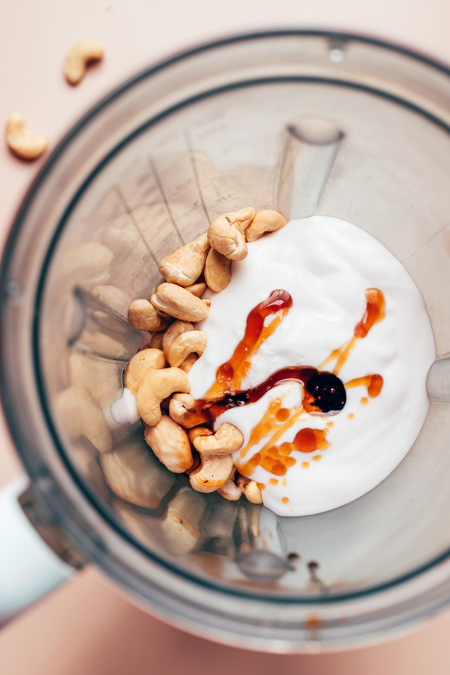 Cashews, coconut yogurt, maple syrup, lemon juice, and salt in a blender