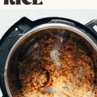 Instant Pot of brown rice with text above it that says perfect every time