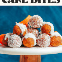 Cake stand filled with no-bake carrot cake bites with text above that says simple and 9 ingredients