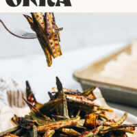 Fork with slices of crispy oven roasted okra with text above that says just 3 ingredients