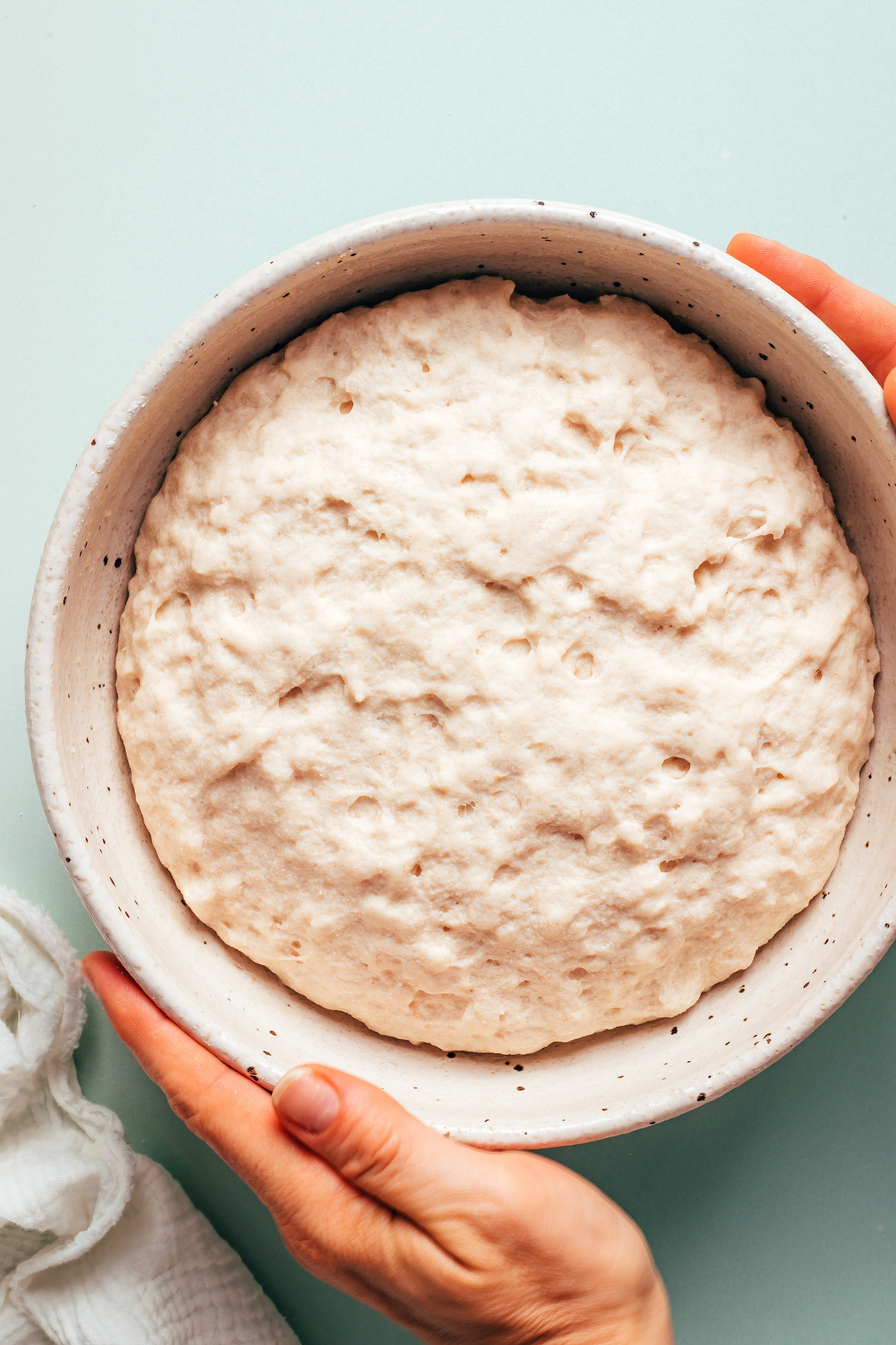 Bowl of fluffy, expanded gluten-free pita dough after proofing