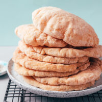Plate stacked high with gluten-free pita bread
